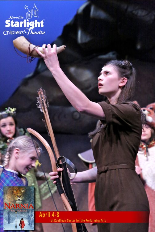 Andrea Fantauzzi receiving Father Christmas' gifts in Narnia The Musical at the Kauffman Center of Performing Arts produced by Starlight Theatre.