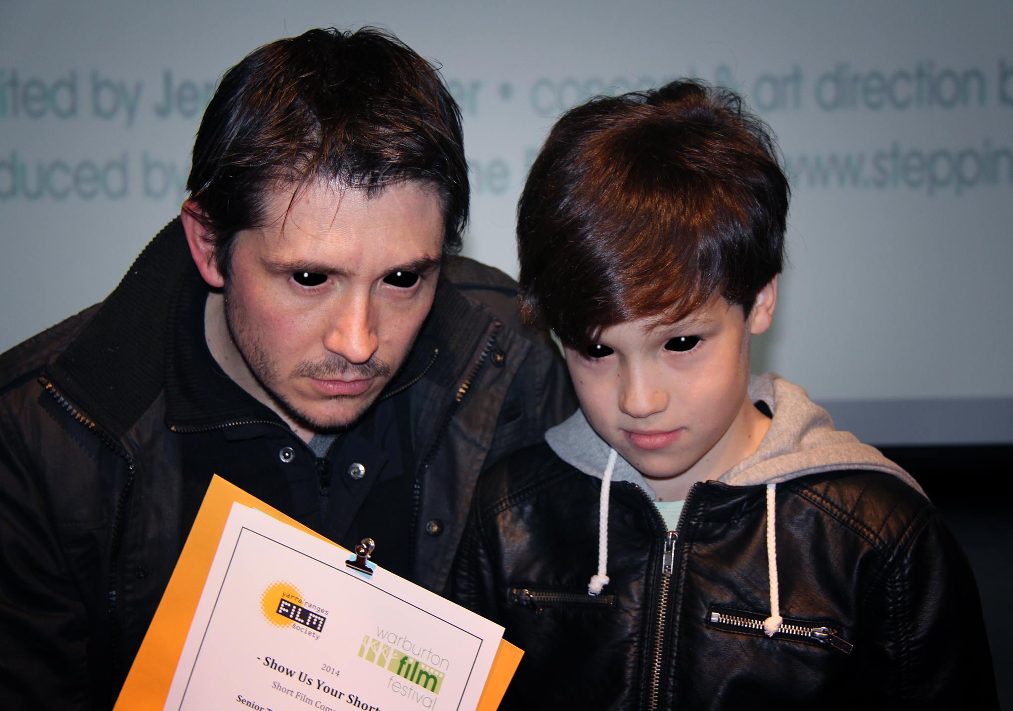 Director Matthew Holmes and Bailey in scary mode collecting an award for The Artifice at Warburton film festival