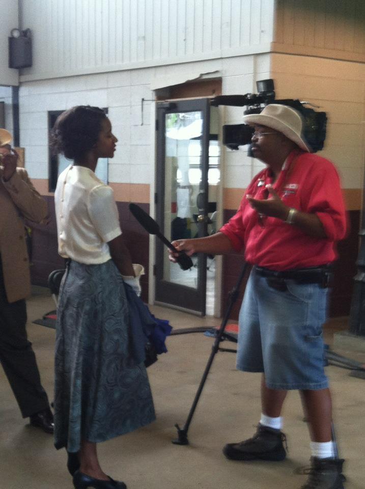 Lora being interviewed on the set of 42: The Legend Of Jackie Robinson