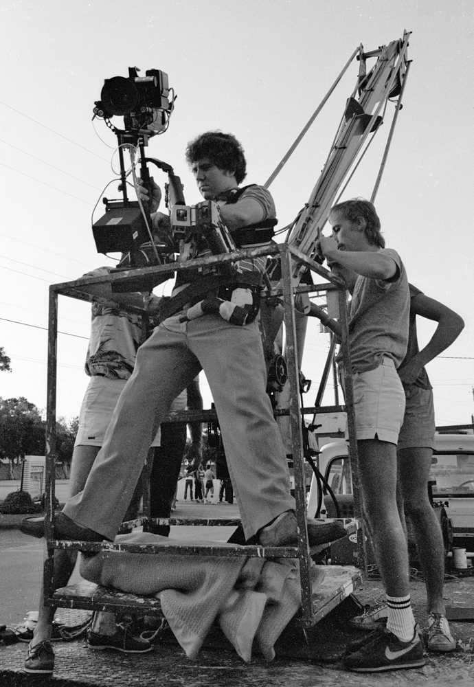 Richard Brown uses a Steadicam in a painter's bucket to simulate a crane shot.