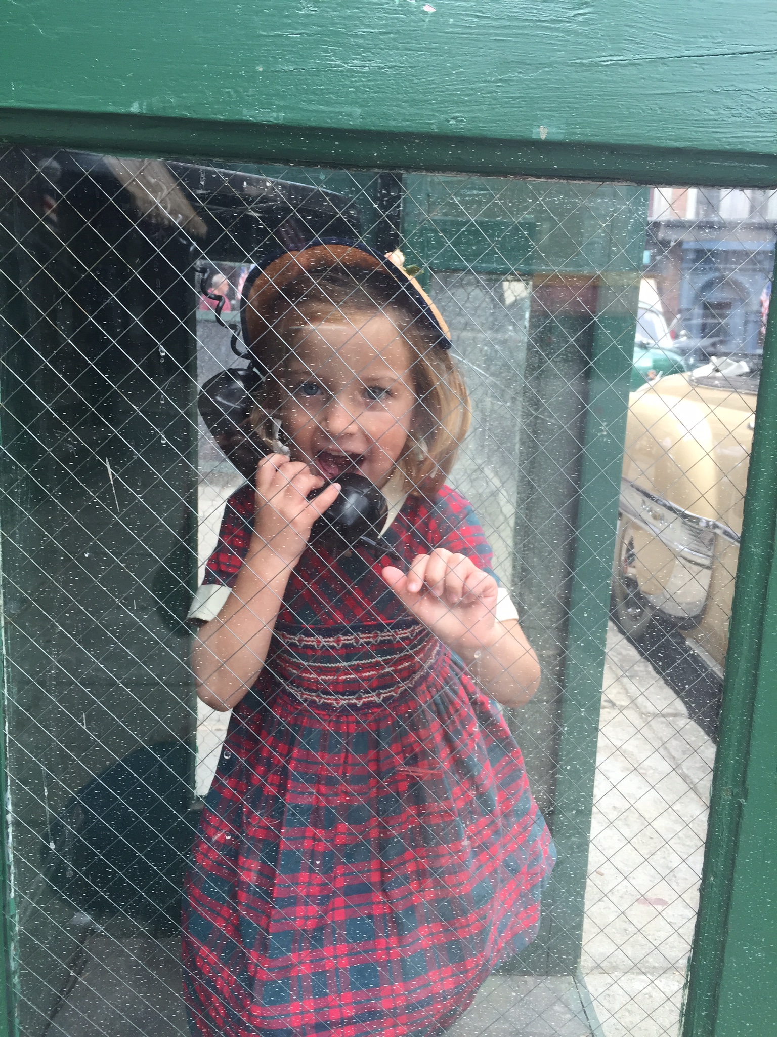 Sunnie having fun in an old phone booth on set for the 200th episode