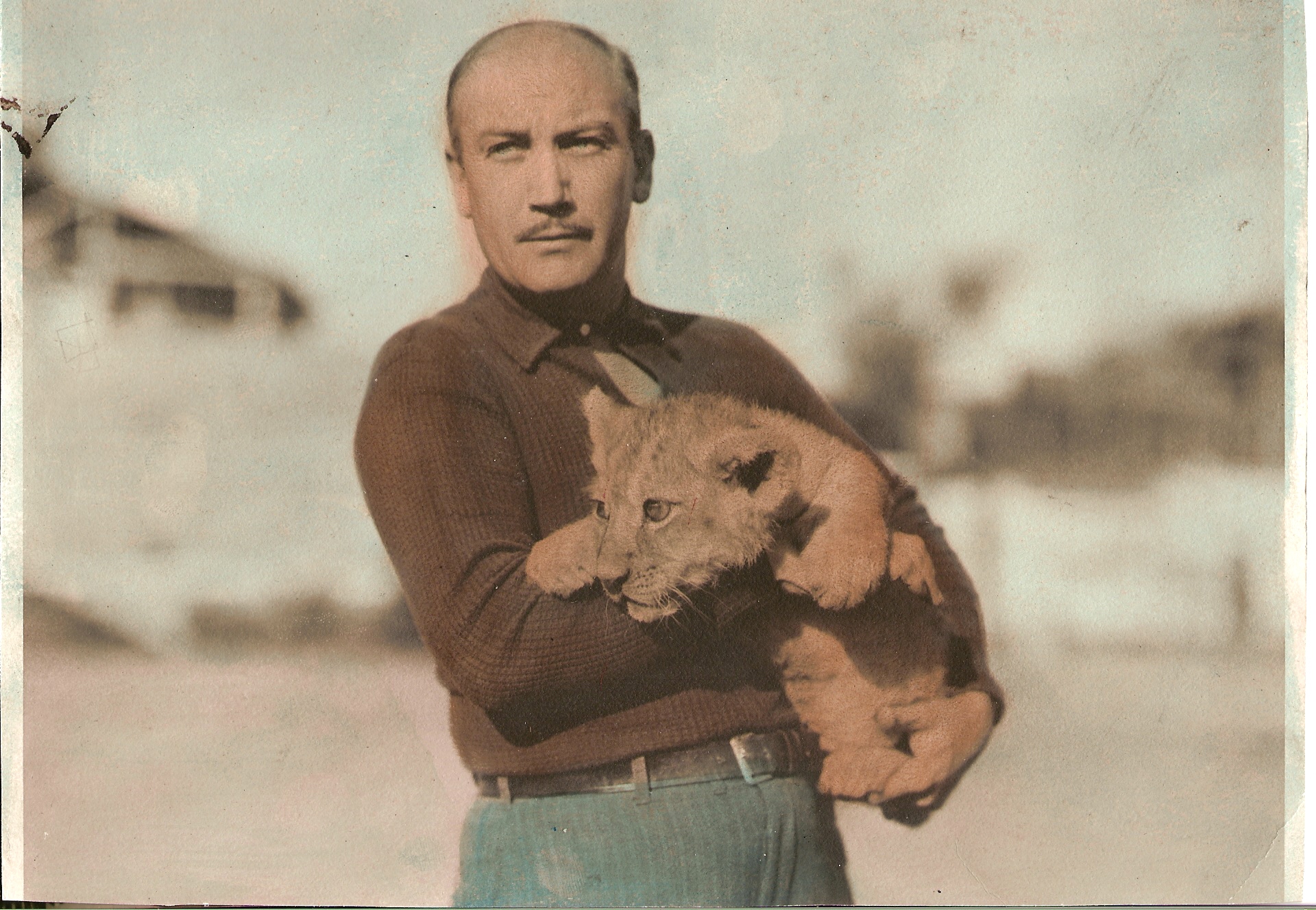 George E. Lee with Leo the Lion baby cub at the MGM Studio Zoo in Culver City