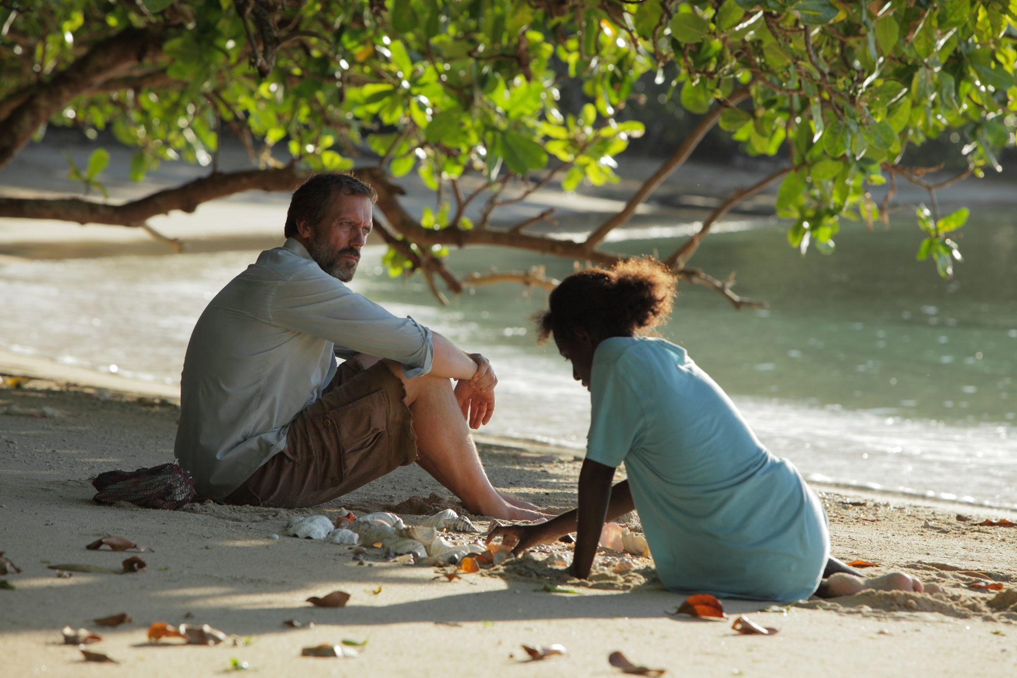 Still of Hugh Laurie and Xzannjah Matsi in Mr. Pip (2012)