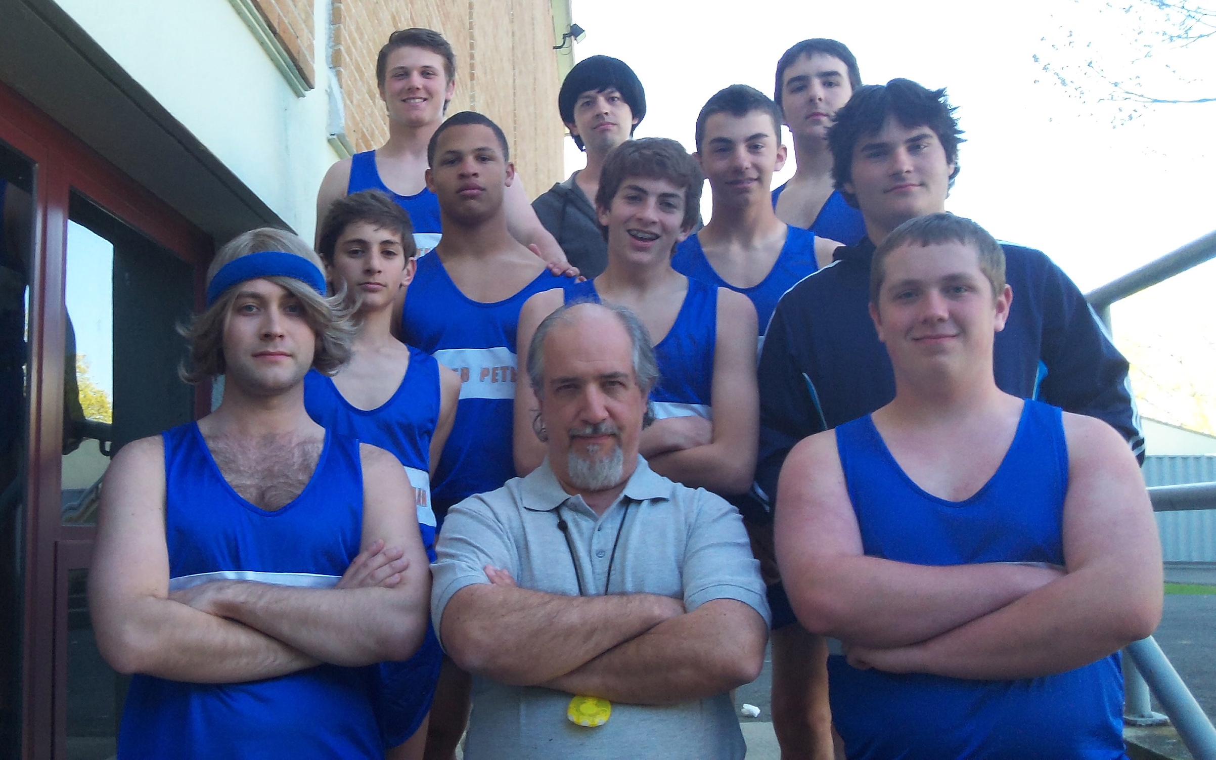 As Coach Peters in Boomer, surrounded by his track team.