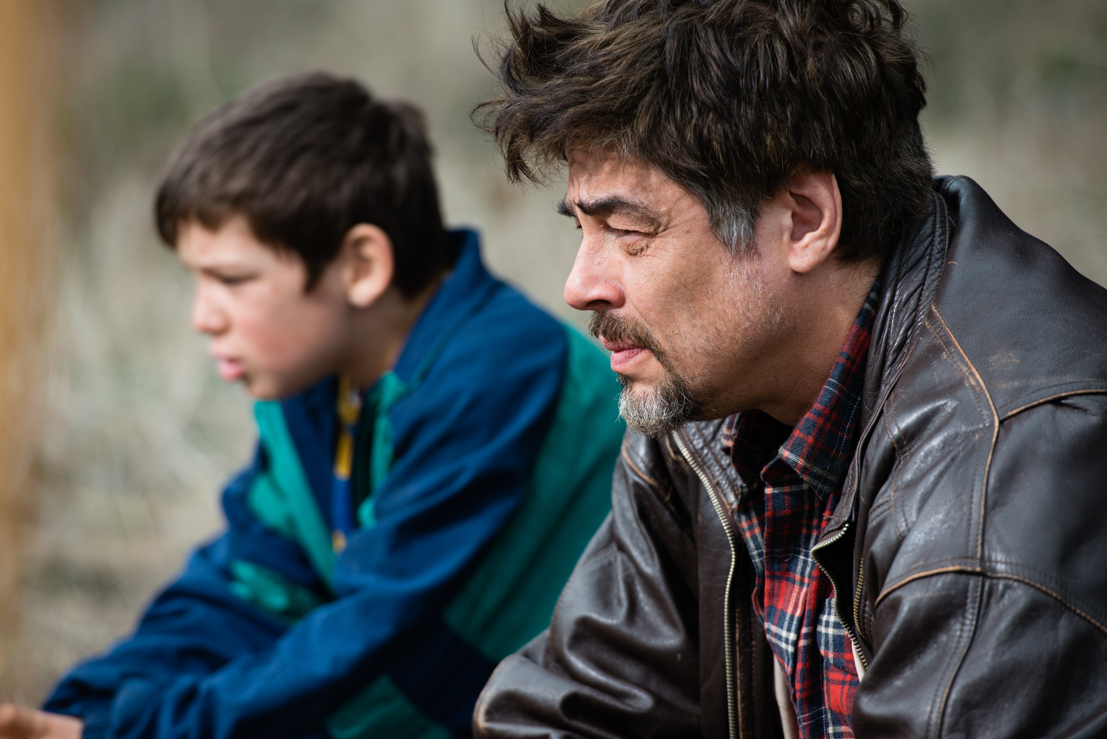 Still of Benicio Del Toro and Eldar Residovic in A Perfect Day (2015)