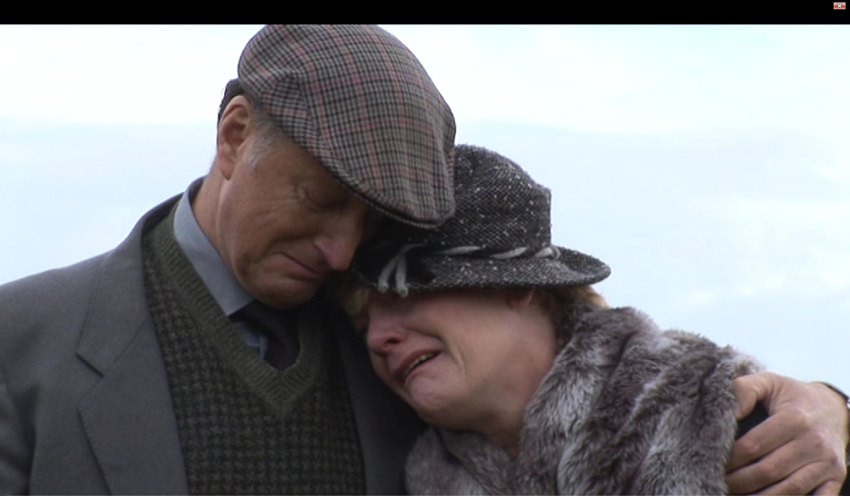 From the film The Lost School. Distraught at our son's grave.