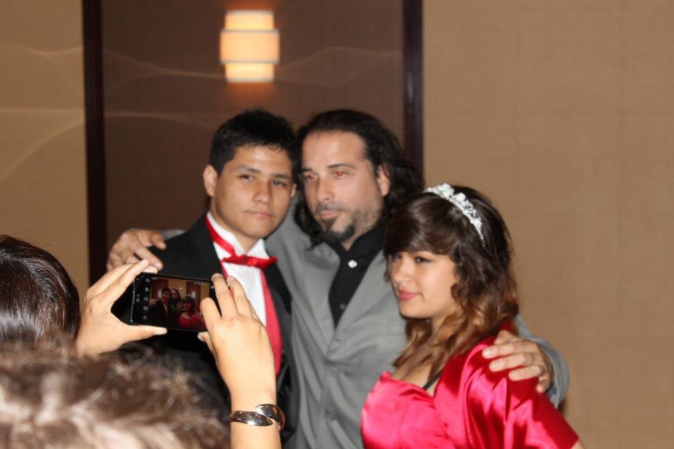 Still of BrenDen Polar with his father and his cousin Julia at her Quinceañera.
