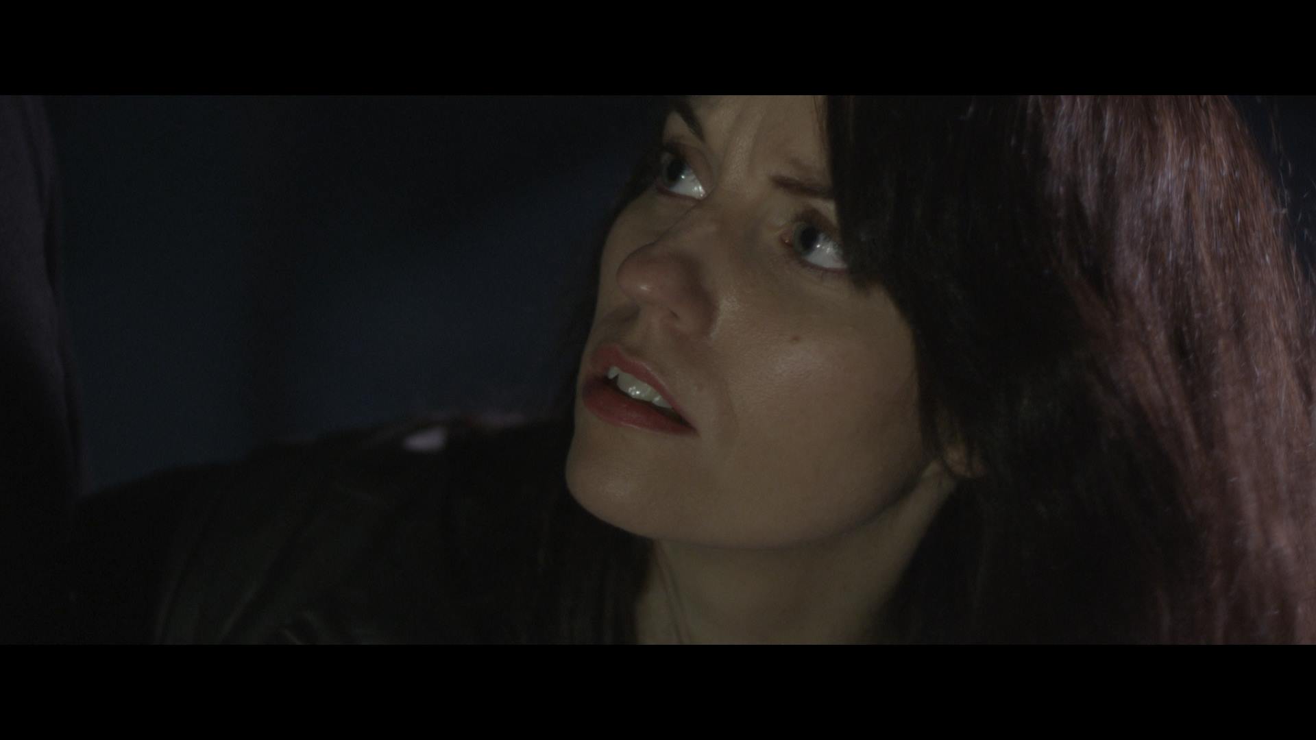 Faith Bruner as Officer Julie Stokes in Dormant.