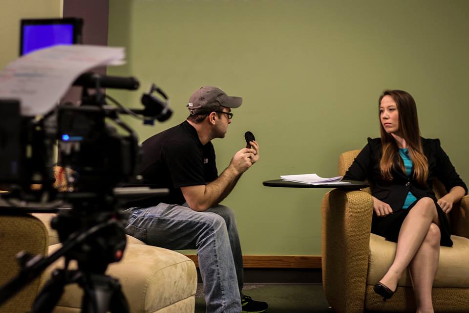 Director Johnathan Paul going over a scene with actress Elizabeth Morris.