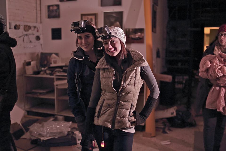 Katie Schurman and Jordan Streussnig smiling behind the scenes....
