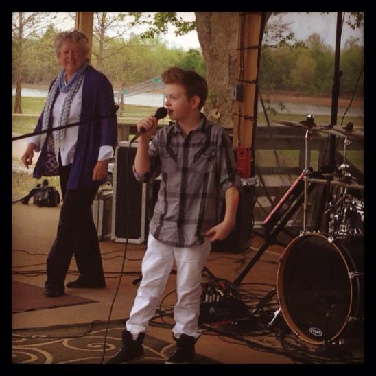Landon performing at the High On The Hog Festival for the Kids Take Nashville TV Show