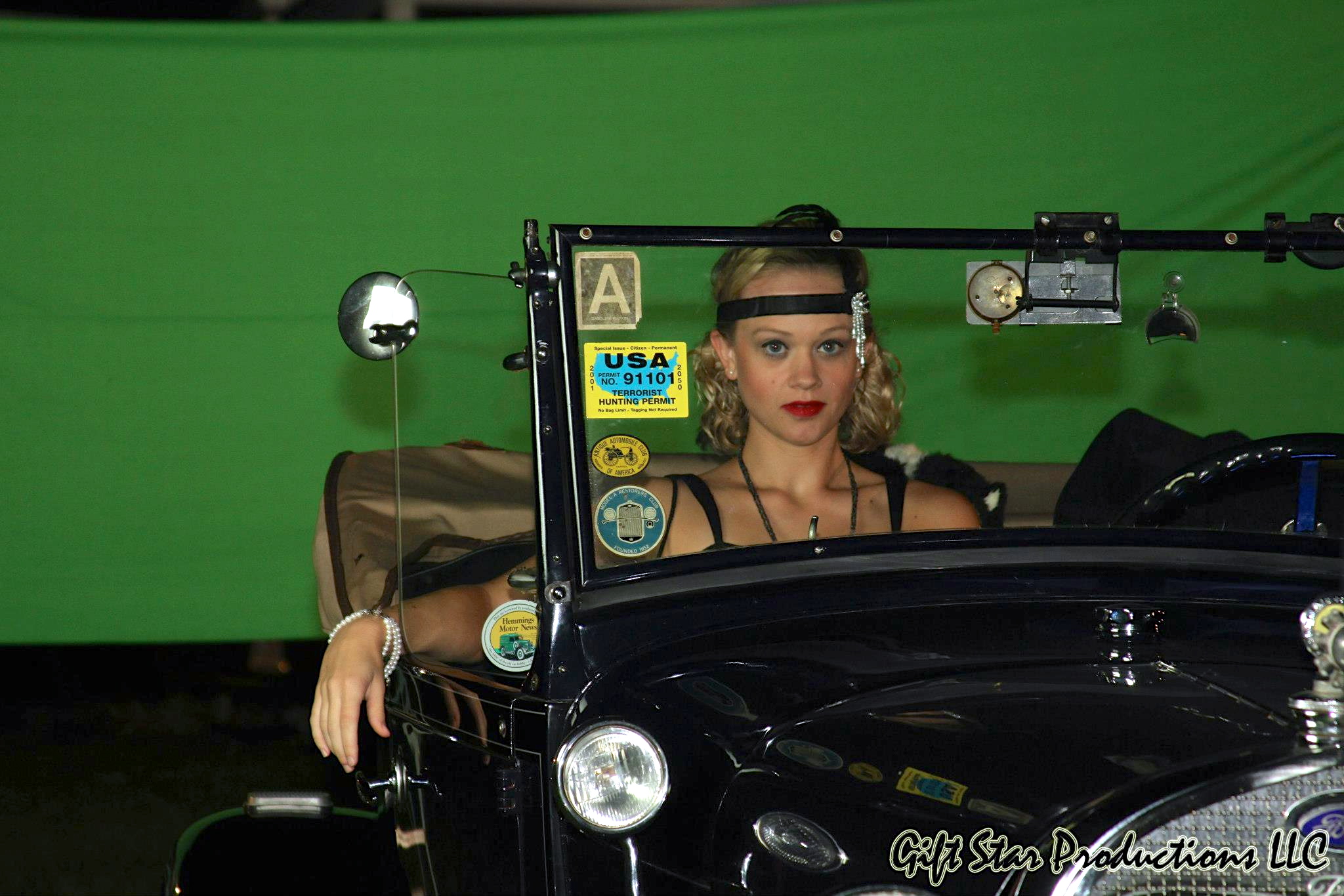 Lucianna on set in a vintage ride!