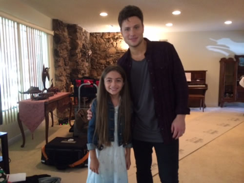 Gracie with singer/song-writer Jamie Scott on set of her music video, 