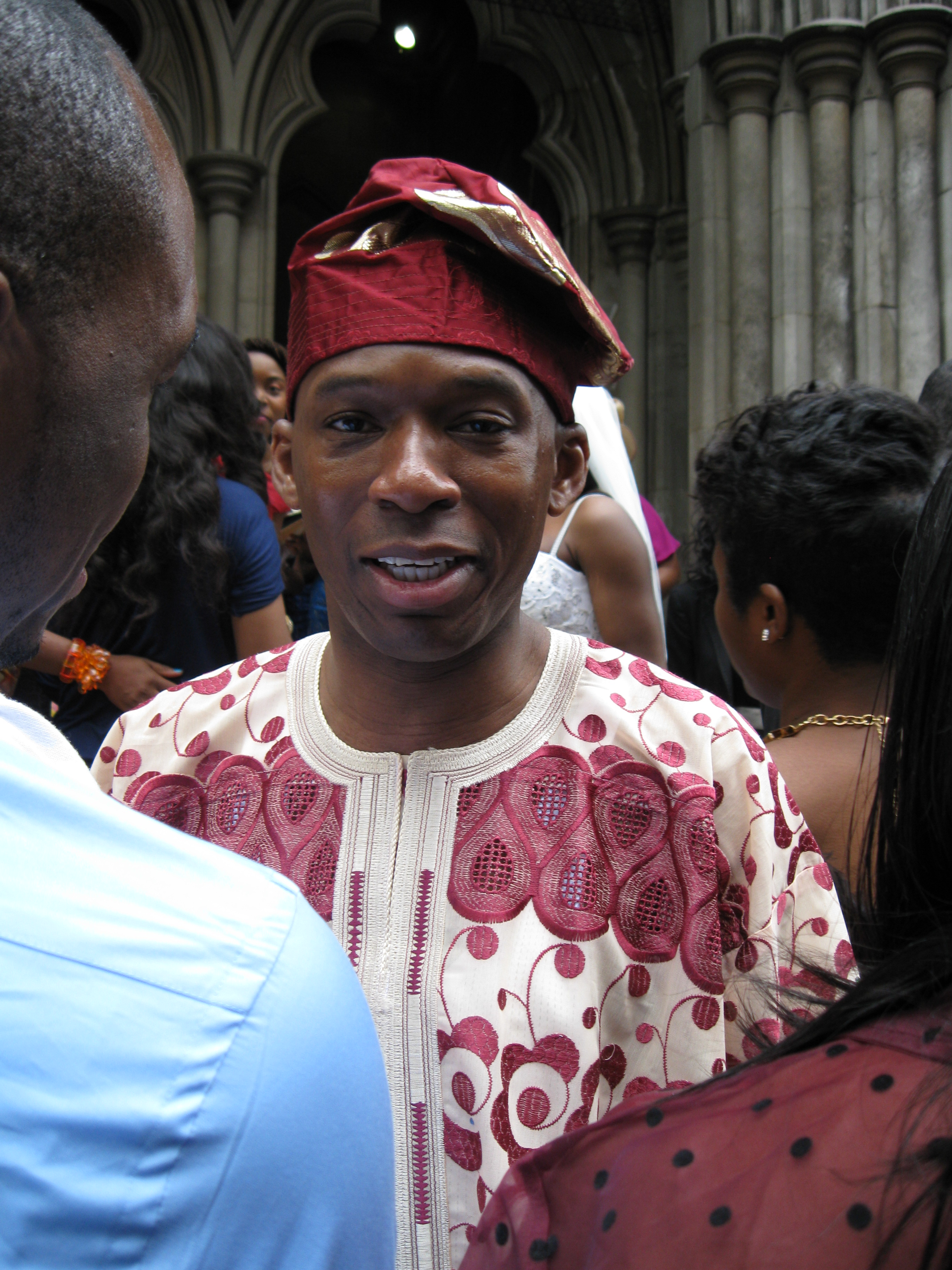 David Olawale Ayinde, actor at Church Wedding Reception, in London, United Kingdom talking and socialising with a Cousin-in-law.