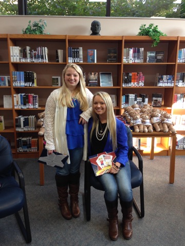Kirsten and Kaitlyn read to kids on Scott Airforce base hosting the 'Bear Essentials' Event for LPE.