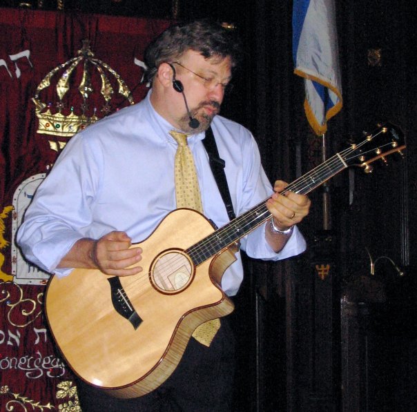 Leaning into an acoustic folk set. (593 Park Avenue, New York, NY)