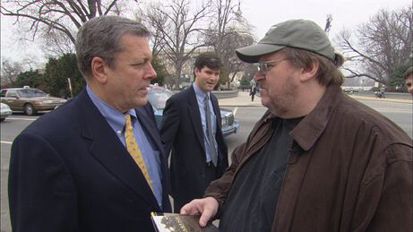 Michael Moore talking with Congressman John Tanner (D-TN) on Capitol Hill. He spent the day there approaching pro-war members of Congress to recruit their children to fight in Iraq.