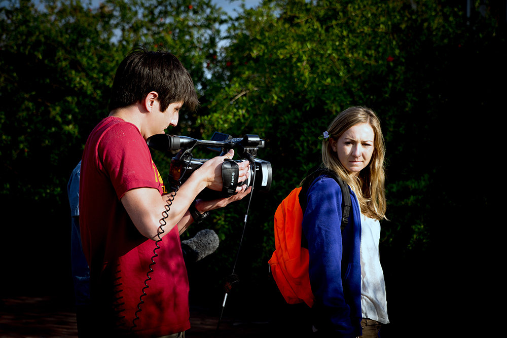 Director Addison Sandoval composing a shot with Actress Carly Van Skaik.