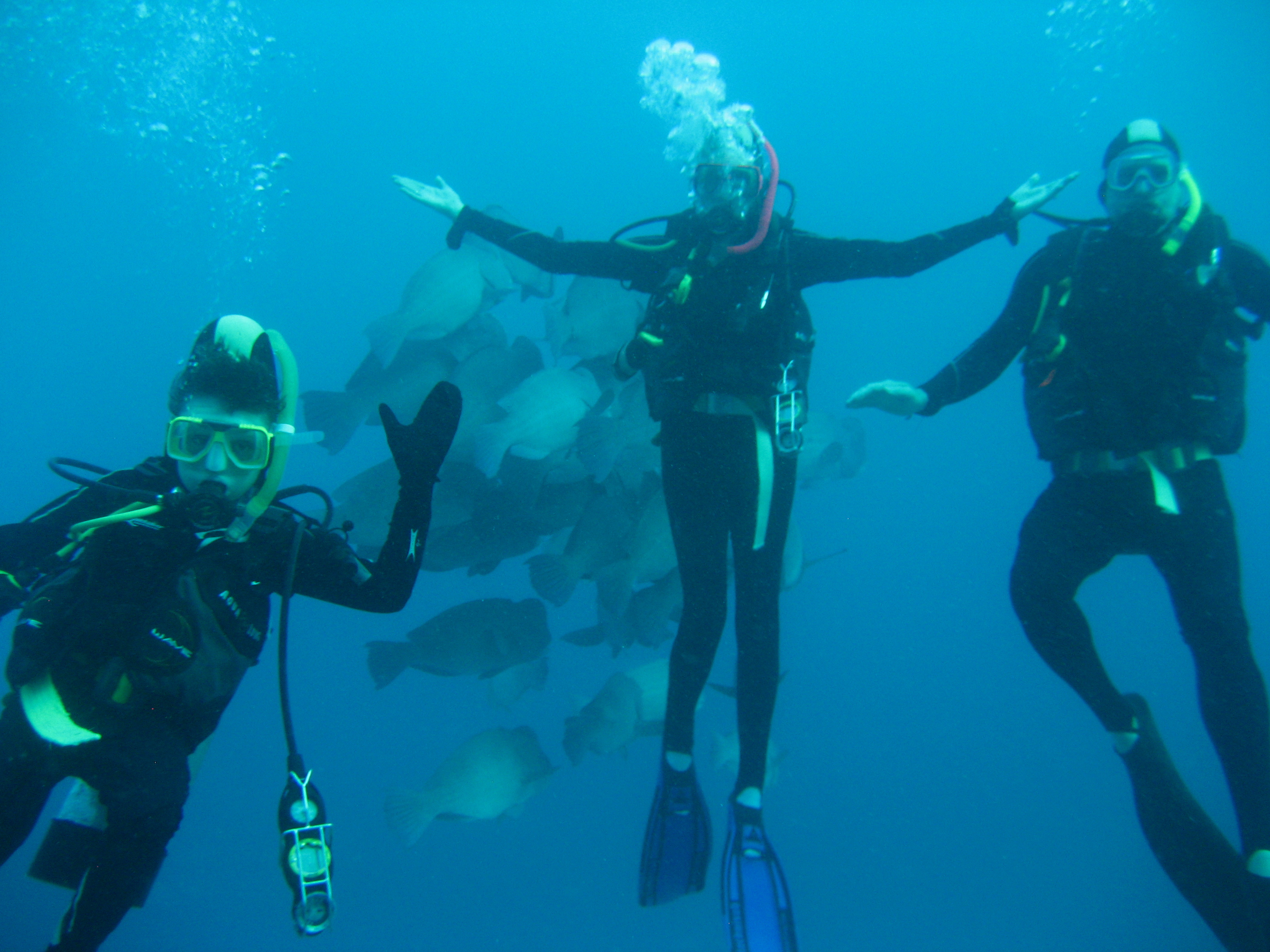 Nicholas Neve and parents scuba diving the Great Barrier Reef. Nicholas in foreground