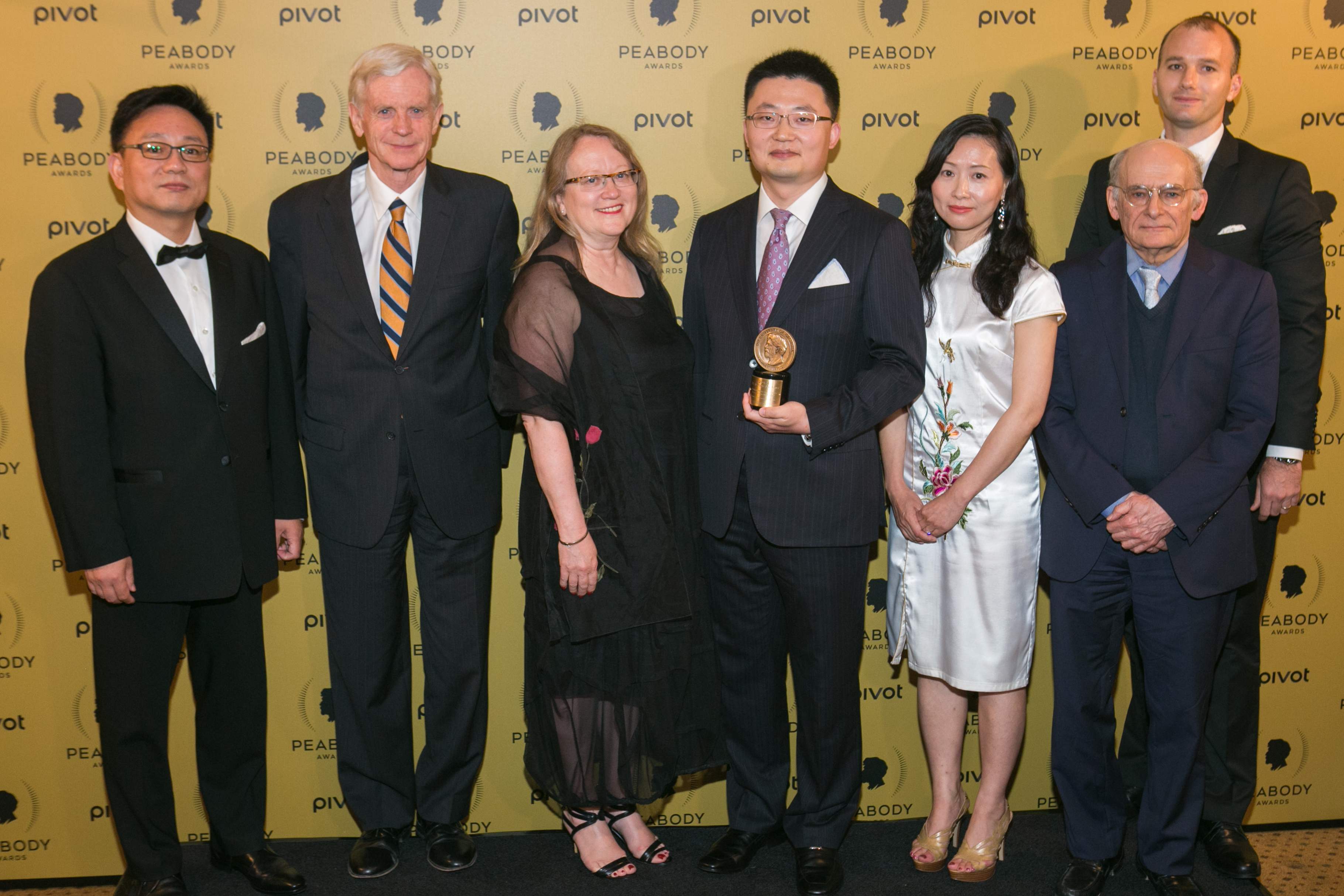 Leon Lee(C) poses with his award and guests at The 74th Annual Peabody Awards Ceremony at Cipriani Wall Street on May 31, 2015 in New York City.
