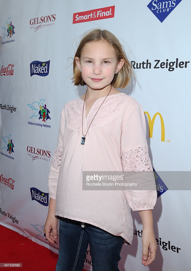 Child actress Camille Schurer arrives at the 17th Annual Day of the Child Carnival presented by Children Uniting Nations at La Brea Tar Pits on November 15, 2015 in Los Angeles, California.