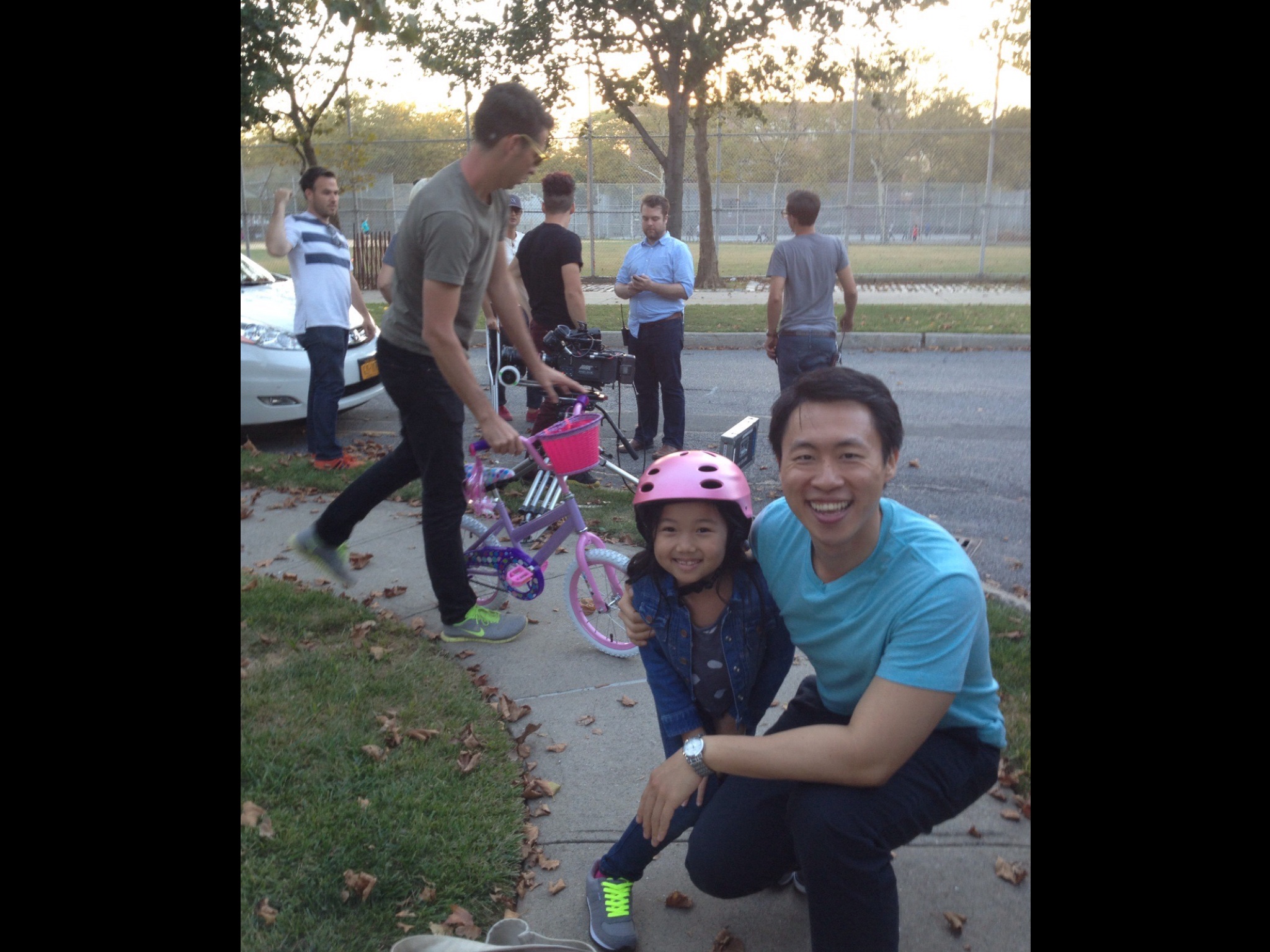Raina Cheng at the DORA VALUES PROMO Shoot for the DORA THE EXPLORER TV Animated Series with Stephen Lin who played her dad helping her ride her bike. 2013