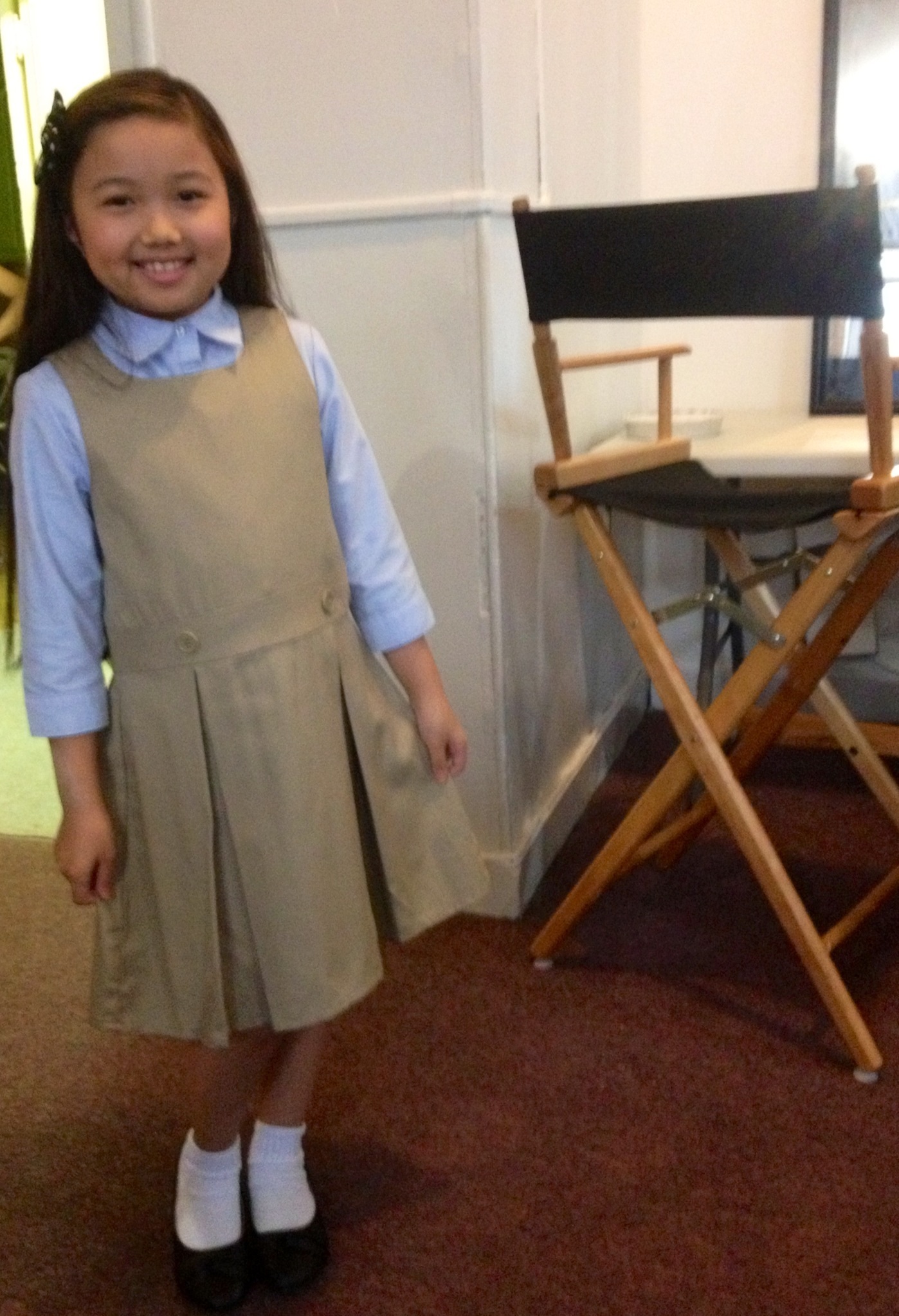Raina Cheng in school uniform provided by wardrobe for an episode on Person of Interest. 2015