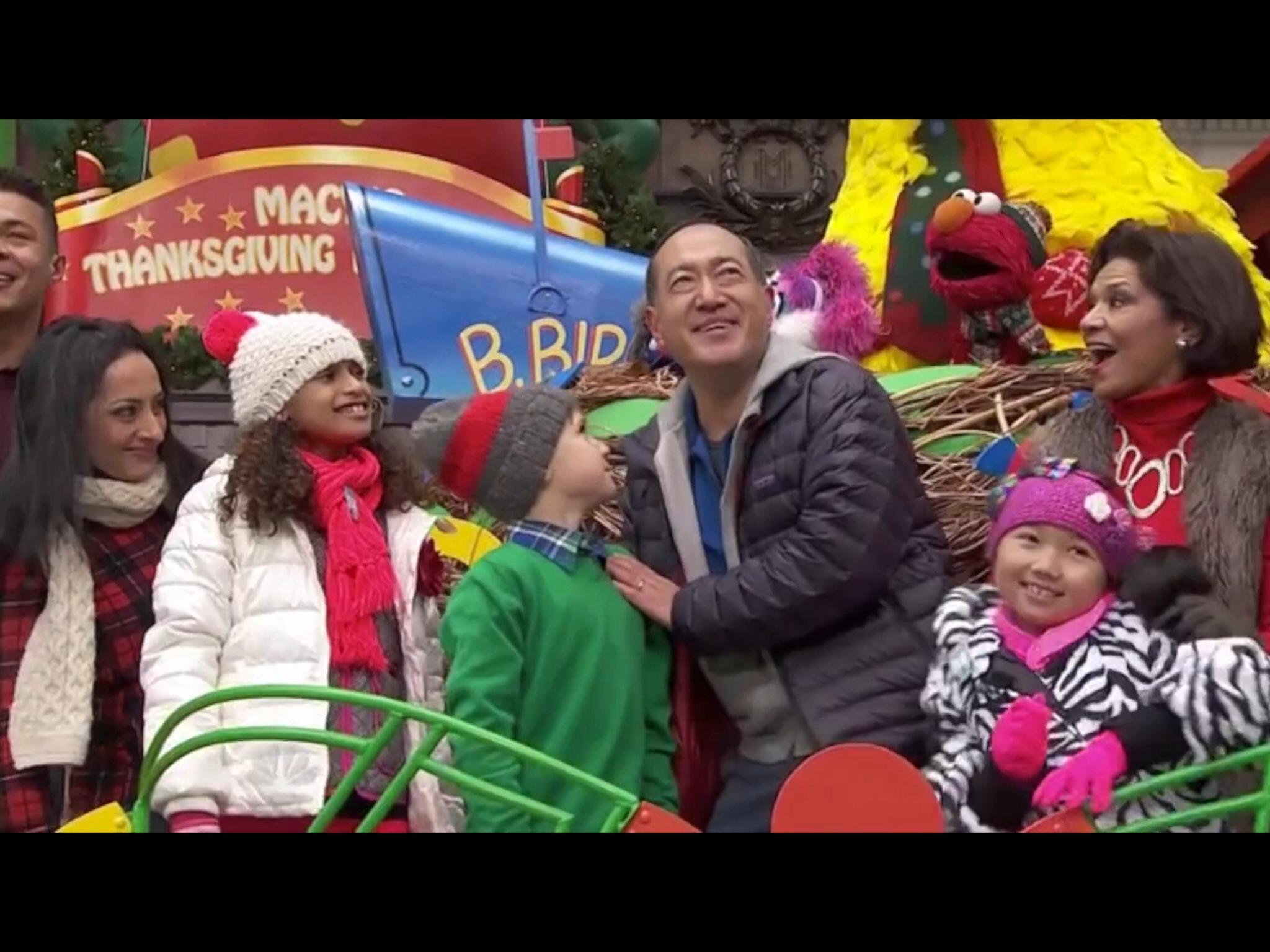 Raina Cheng & cast of a Sesame Street float performing on the Sesame Street float at the Macy's Thanksgiving Day Parade. 2014