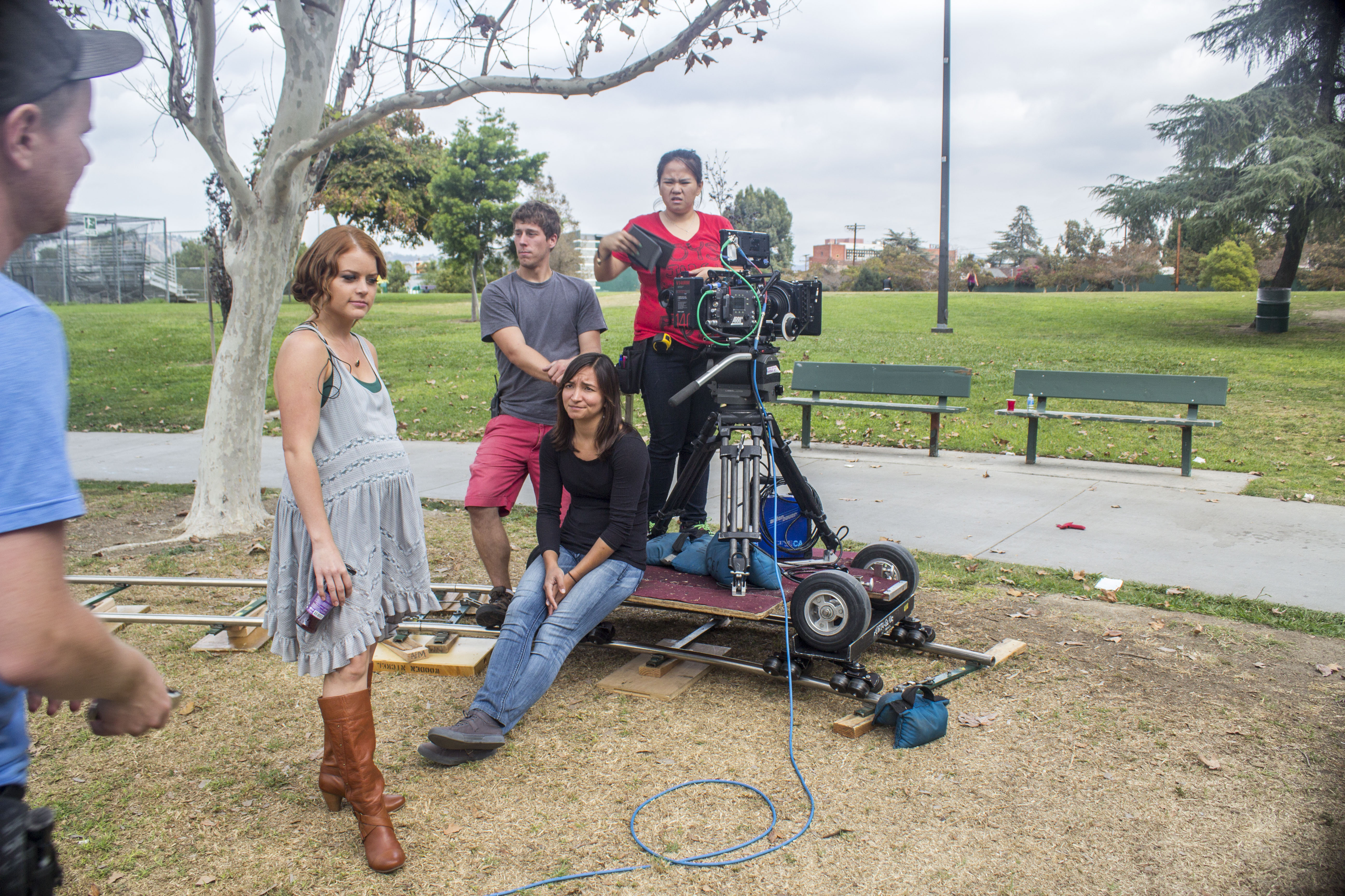 Director Sarah Phillips talks through a scene with Director of Photography Olivia Kuan and the crew.