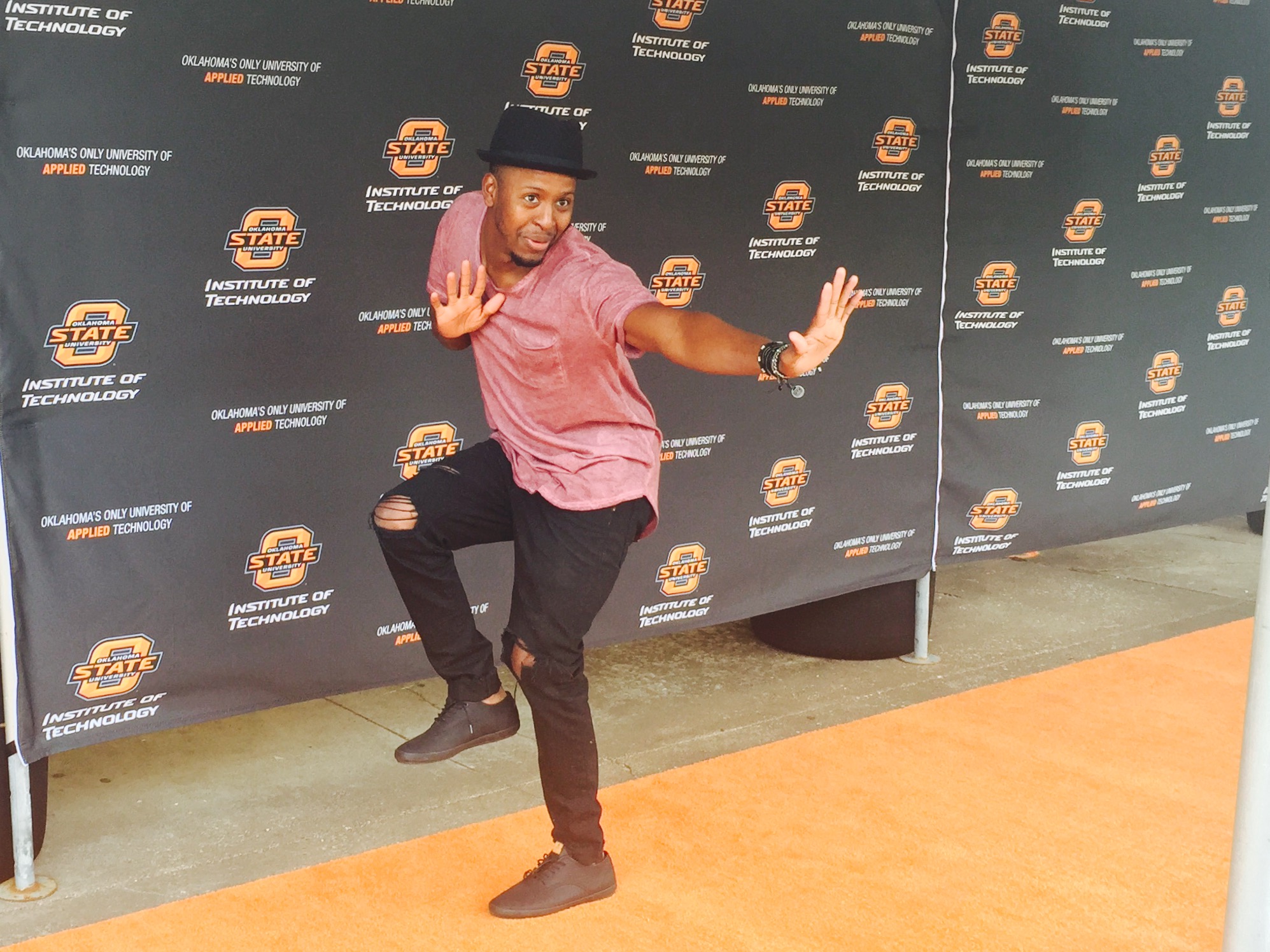 Orange carpet at the Mainstreet 48hr film festival. Brandon doing a pose for the cameras.