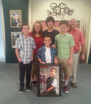 Jordan and his family on the set of an Info-mercial called 