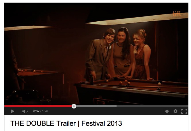 Screenshot from The Double (2013) trailer of Jesse Eisenberg and Jemma Moore.