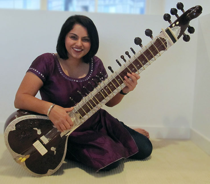 Playing the sitar.