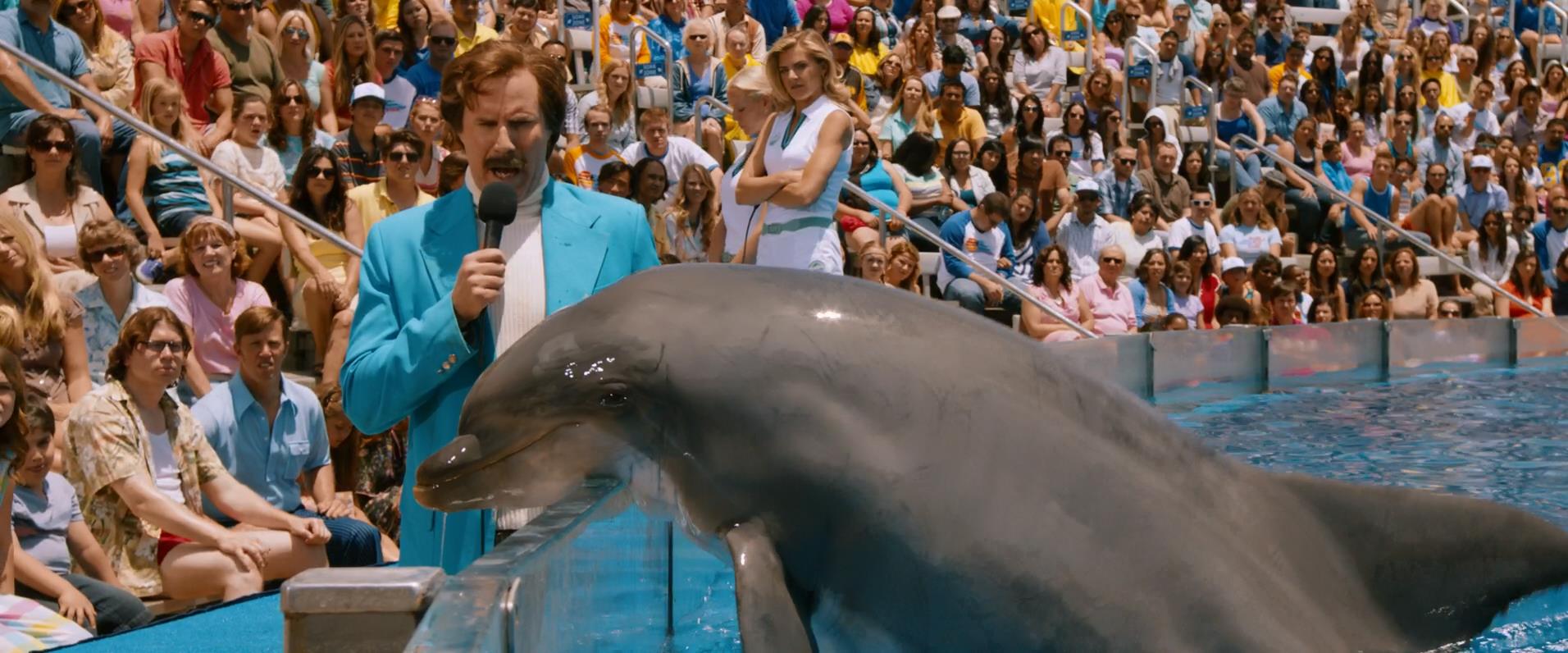 Anchorman 2 - Long hair with glasses. Bottom left corner of picture.