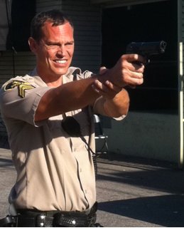 Josh Harp as Police Officer