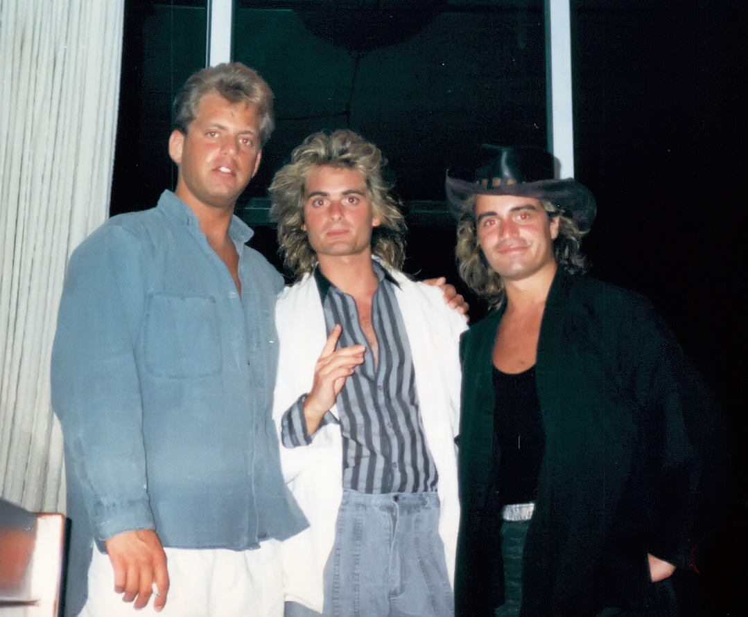 Nicky Kalliongis (center) of Arista Records and Gerard de Marigny (right) party in Rio de Janeiro, Brazil for Carnival - c. 1987.