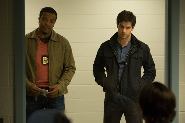 Still of Russell Hornsby and David Giuntoli in Grimm (2011)