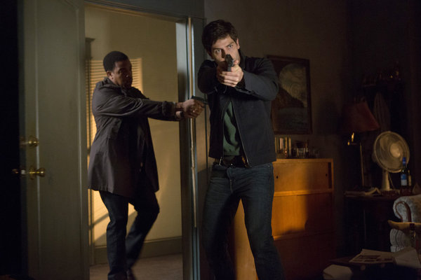 Still of Russell Hornsby and David Giuntoli in Grimm (2011)