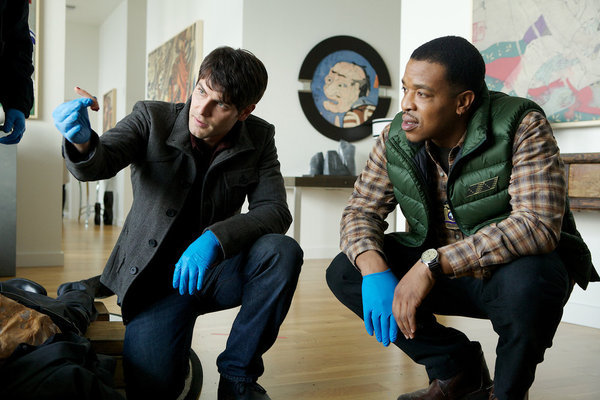 Still of Russell Hornsby and David Giuntoli in Grimm (2011)