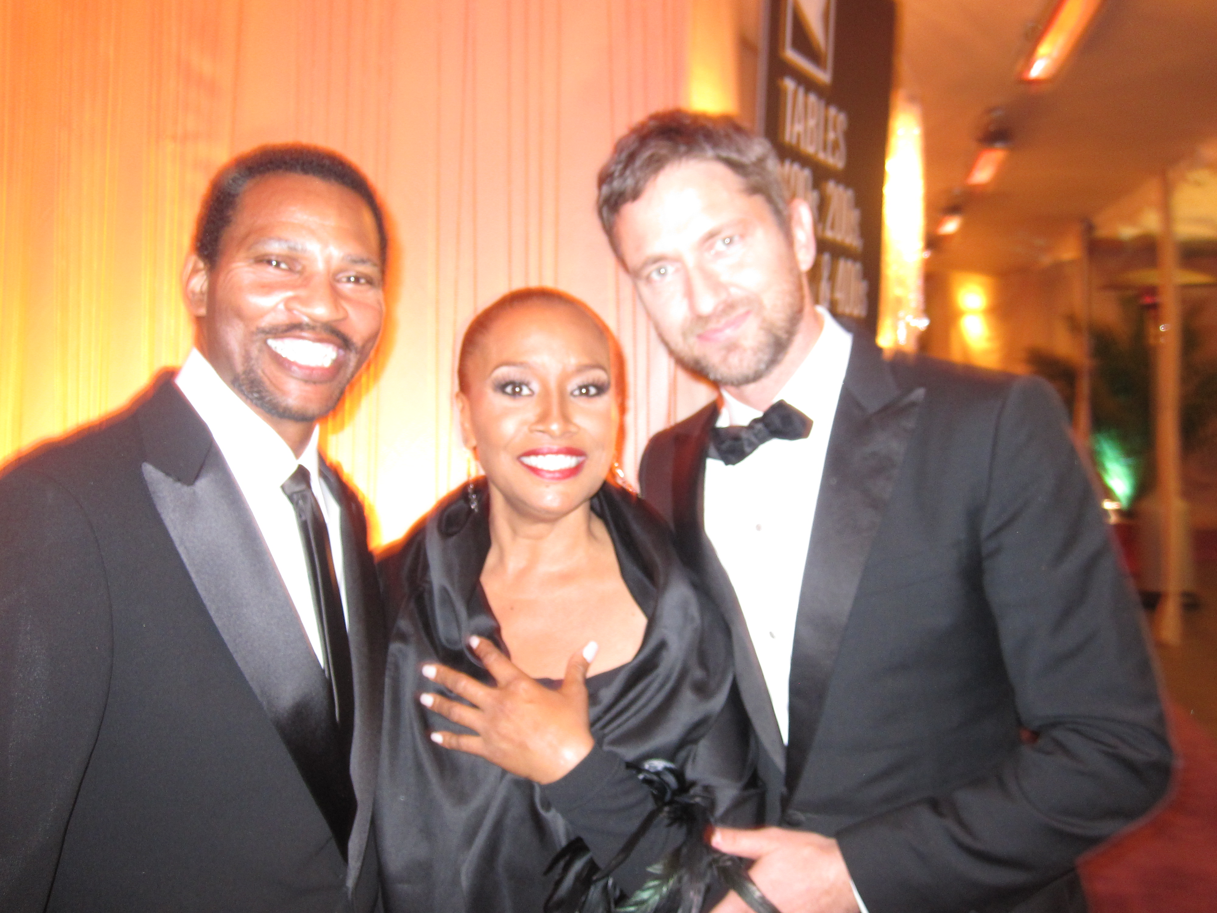Jenifer Lewis and Arnold Byrd with Gerard Butler at the 2010 Academy Awards ceremony in Los Angeles, California.