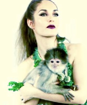 Justine Sophia on set with Zumi the Capuchin Monkey