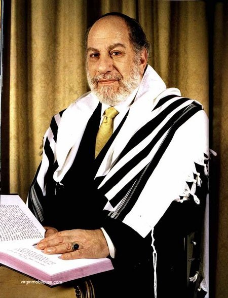 A kinder gentler Bern Cohen as the Virgin cellular Rabbi.