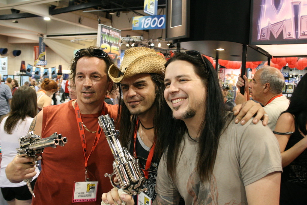 Kevin Eastman and Digger Mesch with prop three-barrel revolvers from Fistful of Blood.