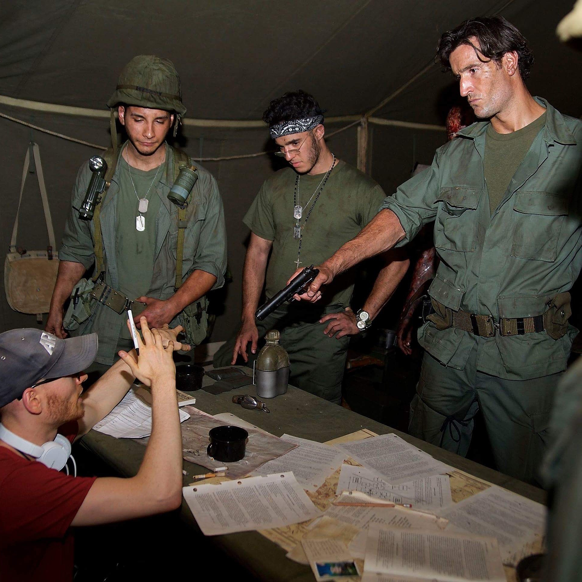 Director Alex Thompson in the midst of directing Angel Luis, Mario Temes and Matthew Del Negro in 