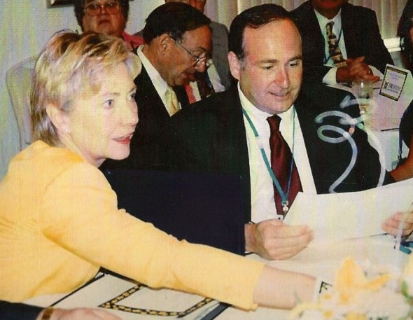 Hillary Clinton & Don Metzner. Hillary is preparing for her speech and Metzner is preparing for his introduction of her.