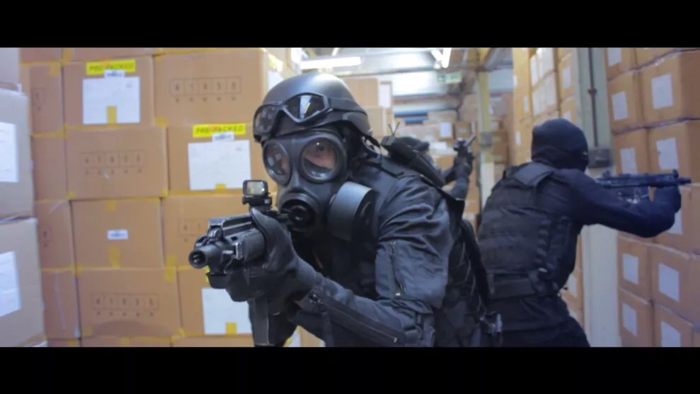 ARCHIE COCKER AS SWAT TAKEN FROM A FILM BY THE HAMILL BRO'S THE WRONG FLOOR