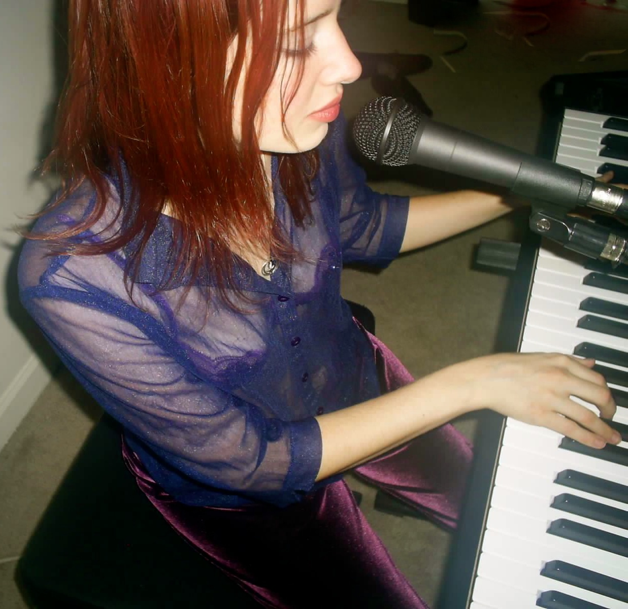 singing and playing her Roland 300-SX