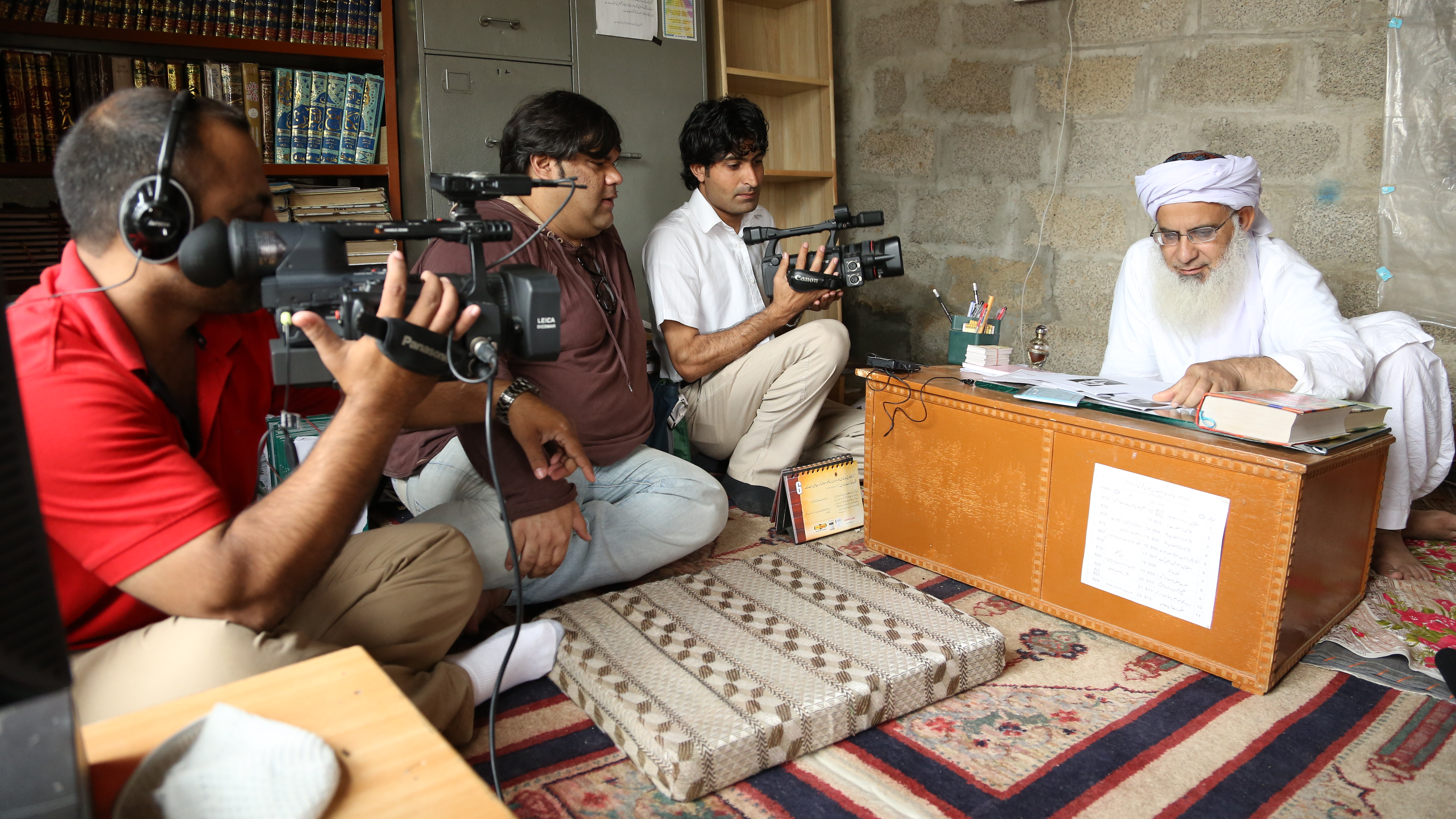 Still of Mohammed Naqvi and Haider Ali in Among the Believers (2015)