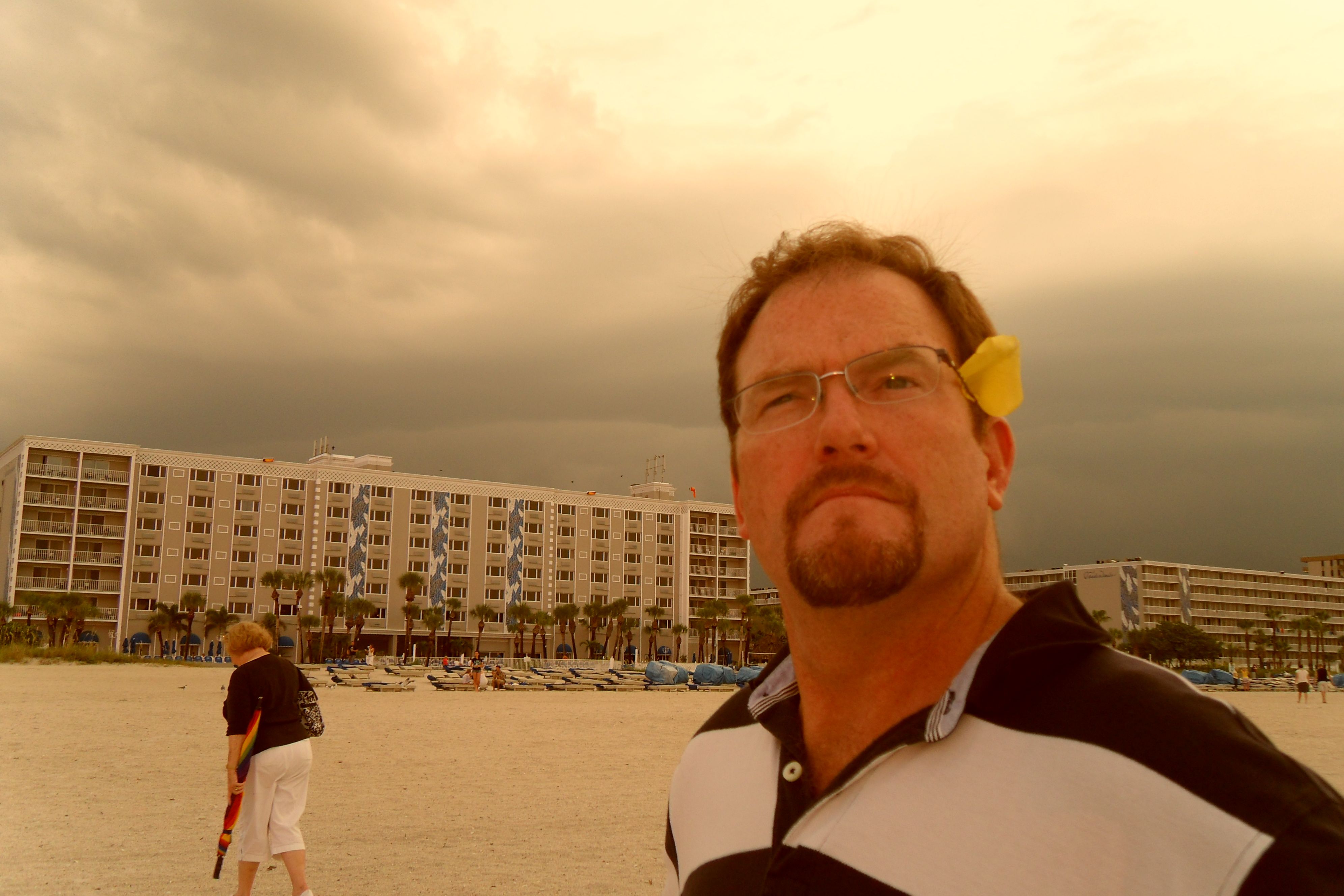 Contemplating the 60 mph wind on Clearwater beach, usually the last to leave