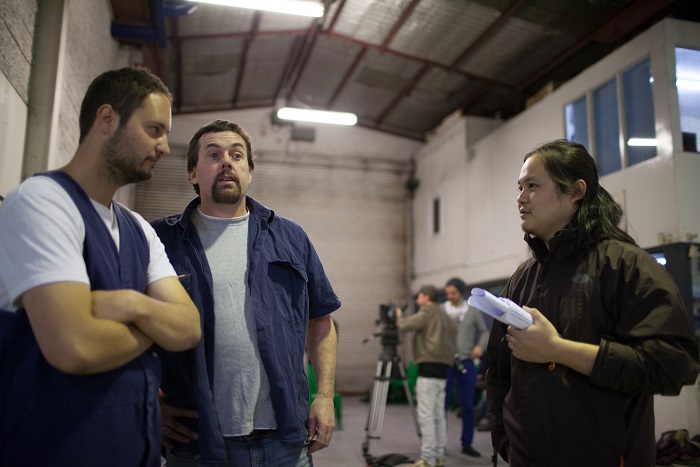 Karl Robinson On Set The World (2013) Taking direction from Qiu Yang (Director)